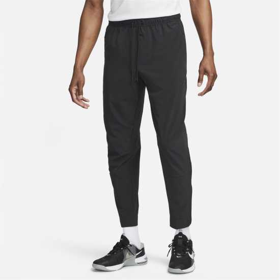 Nike Unlimited Men's Dri-FIT Zippered Cuff Versatile Pants Трикратно черно Мъжки спортни екипи в две части