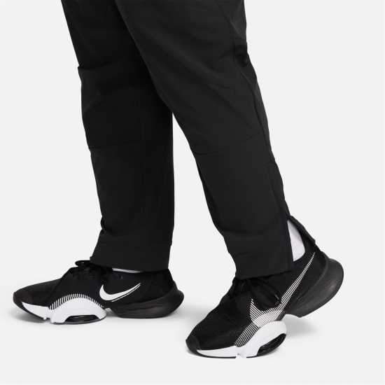 Nike Unlimited Men's Dri-FIT Zippered Cuff Versatile Pants Трикратно черно Мъжки спортни екипи в две части