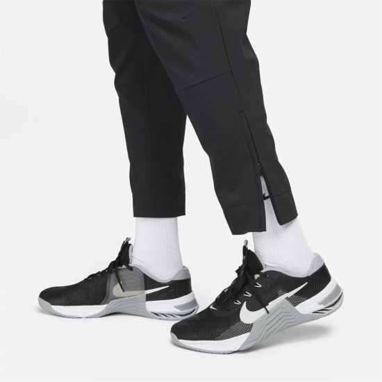 Nike Unlimited Men's Dri-FIT Zippered Cuff Versatile Pants Трикратно черно Мъжки спортни екипи в две части