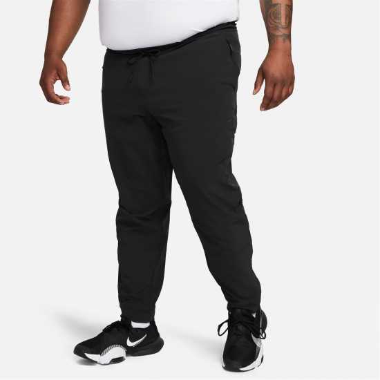 Nike Unlimited Men's Dri-FIT Zippered Cuff Versatile Pants Трикратно черно Мъжки спортни екипи в две части